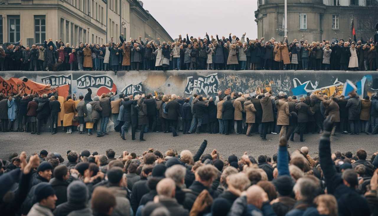 The Berlin Wall crumbles as people celebrate, symbolizing the end of the Cold War